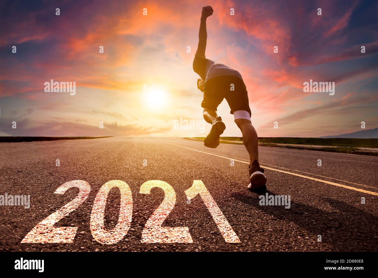 man running and sprinting on road with 2021 new year concept Stock Photo