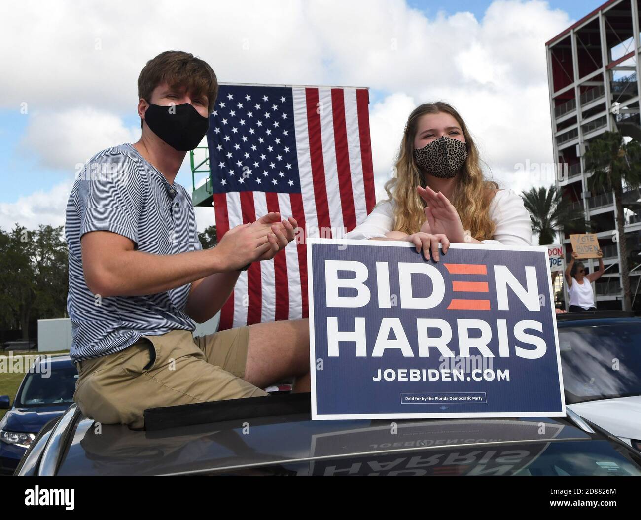 October 27, 2020 - Orlando, Florida, United States - People hold signs while waiting for former U.S. President Barack Obama to speak in support of Democratic presidential nominee Joe Biden during a drive-in rally on October 27, 2020 in Orlando, Florida. Mr. Obama is campaigning for his former Vice President before the Nov. 3rd election. (Paul Hennessy/Alamy) Credit: Paul Hennessy/Alamy Live News Stock Photo