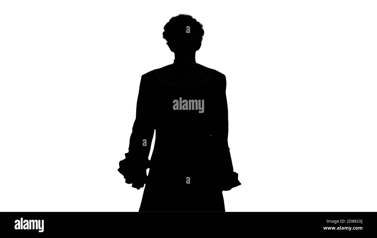 Silhouette Man in old-fashioned laced frock coat and white wig w Stock Photo