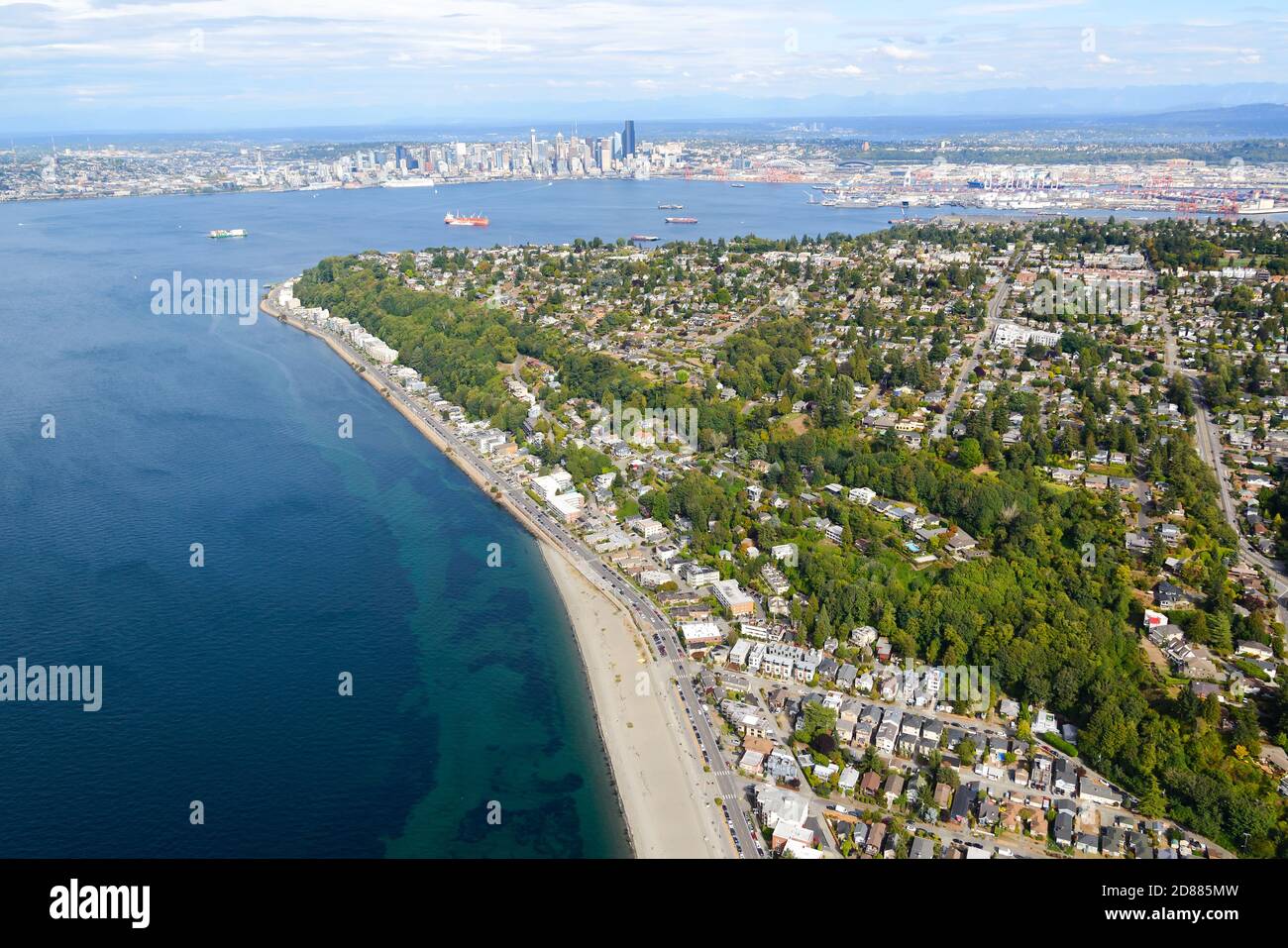 Alki Beach and North Admiral aerial view with Seattle skyline and Elliot Bay behind. West Seattle seen from above. Stock Photo
