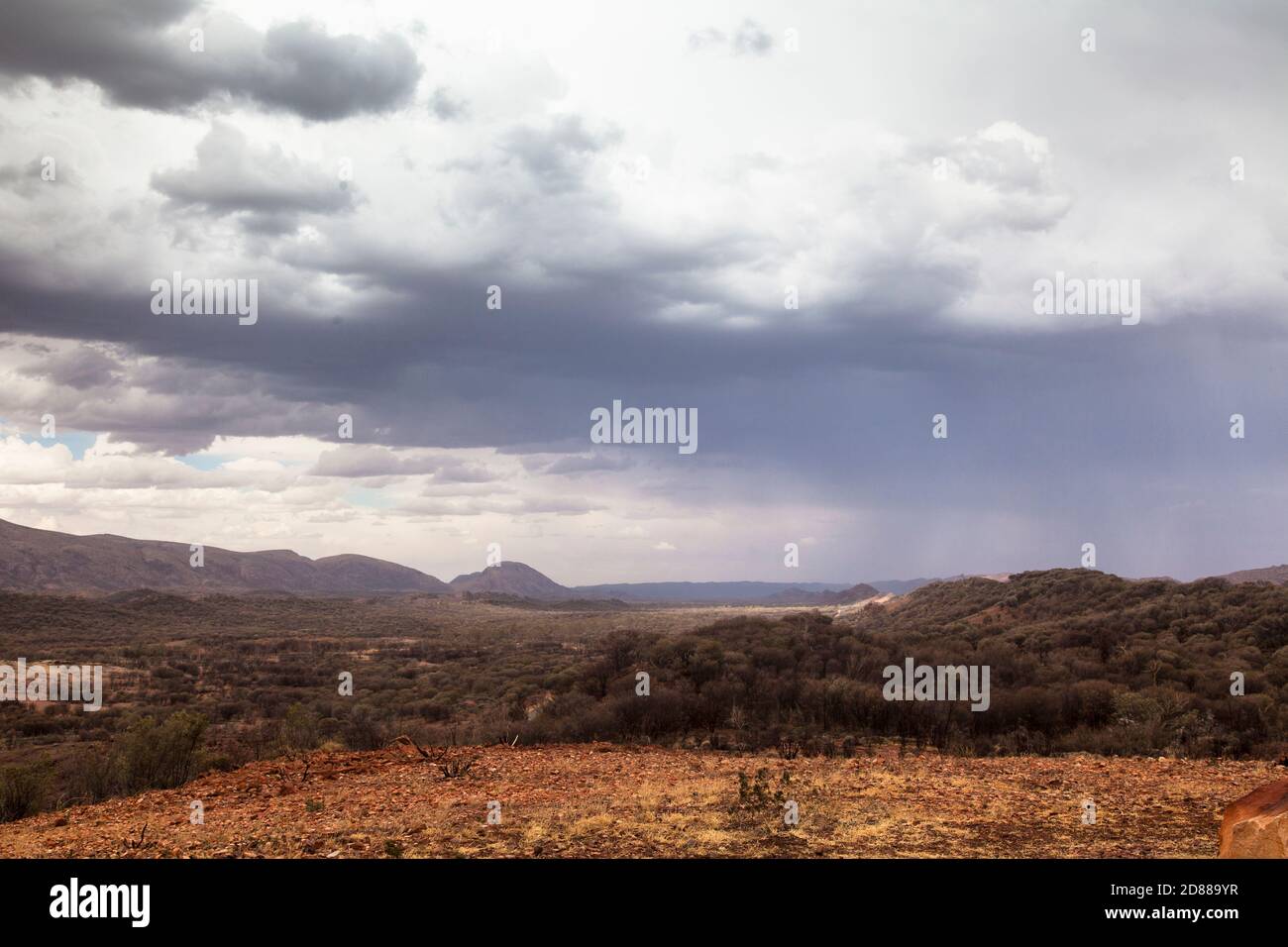 Cumulonimbus Storm clouds and rain over the West Macdonnell Ranges / Tjoritja, Central Australia Stock Photo