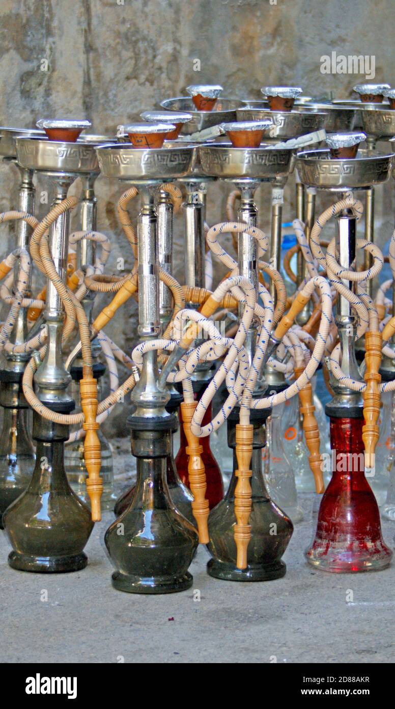 Many glass narghile waterpipes, also known as hookah or argileh, outside a hookah bar in Hamra, Beirut, Lebanon. Stock Photo