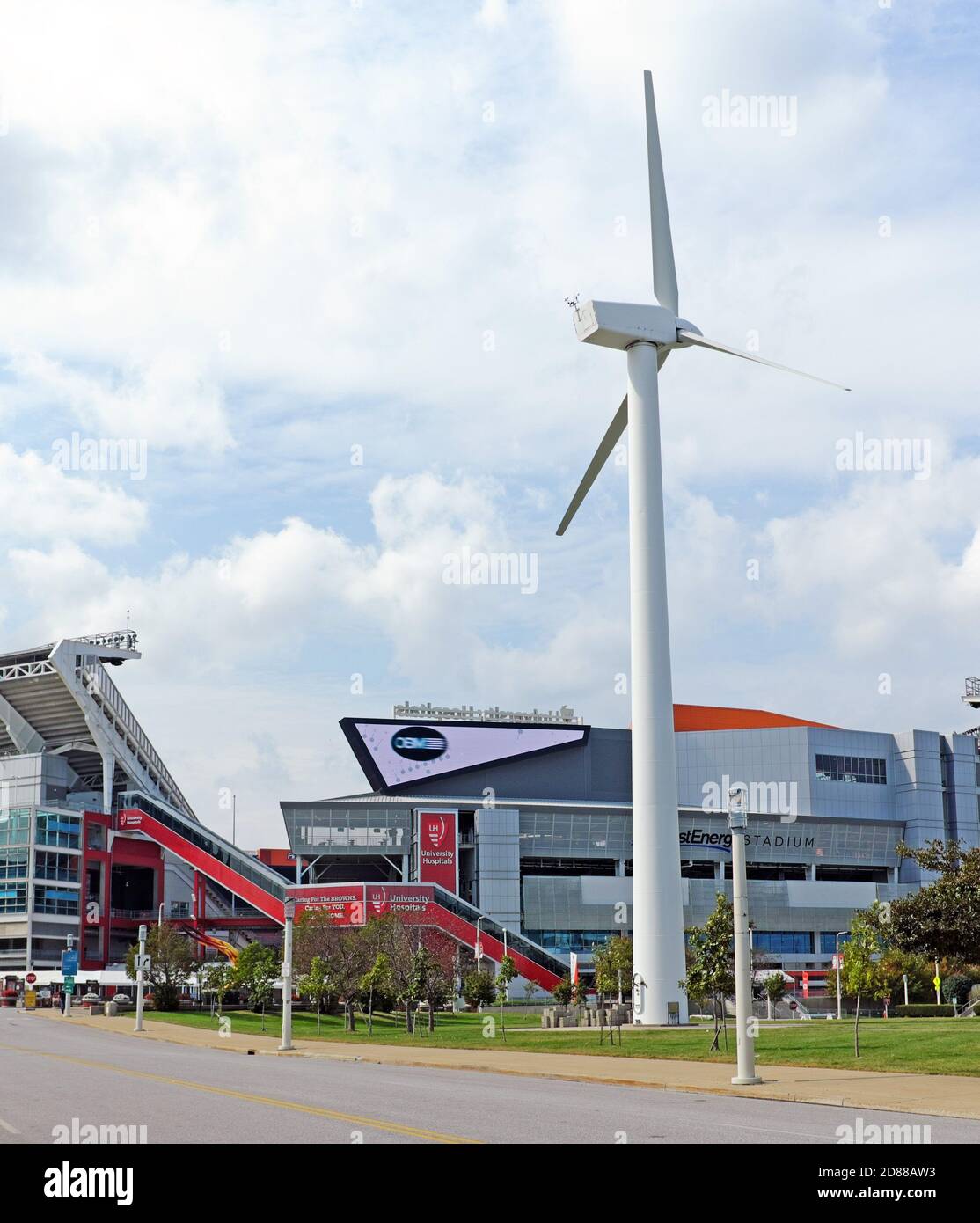 Lakefront attractions in Cleveland, Ohio includes FirstEnergy Stadium and a working giant wind turbine in front of the Great Lakes Science Center. Stock Photo