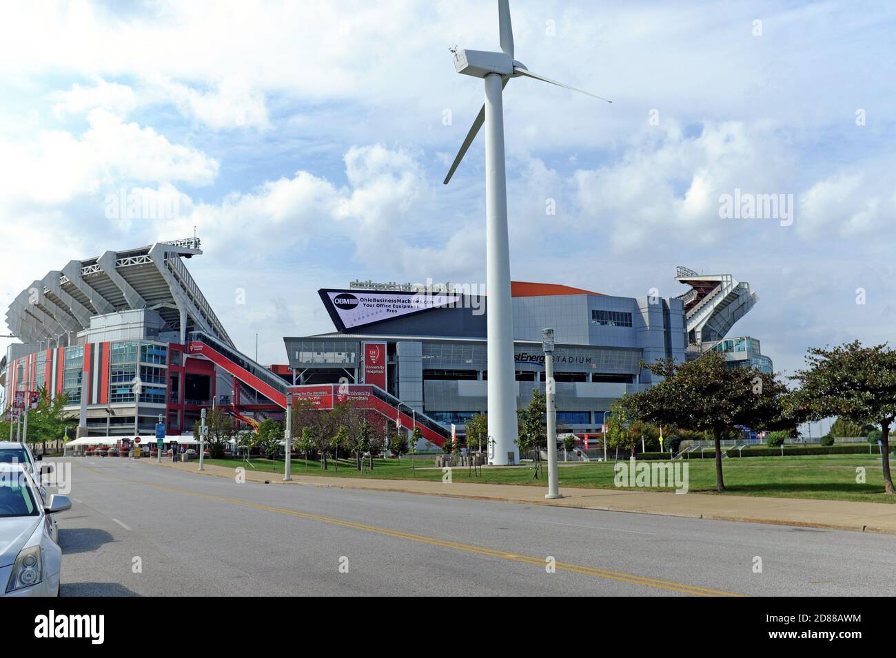 Lakefront attractions in Cleveland, Ohio includes FirstEnergy Stadium and a working giant wind turbine in front of the Great Lakes Science Center. Stock Photo