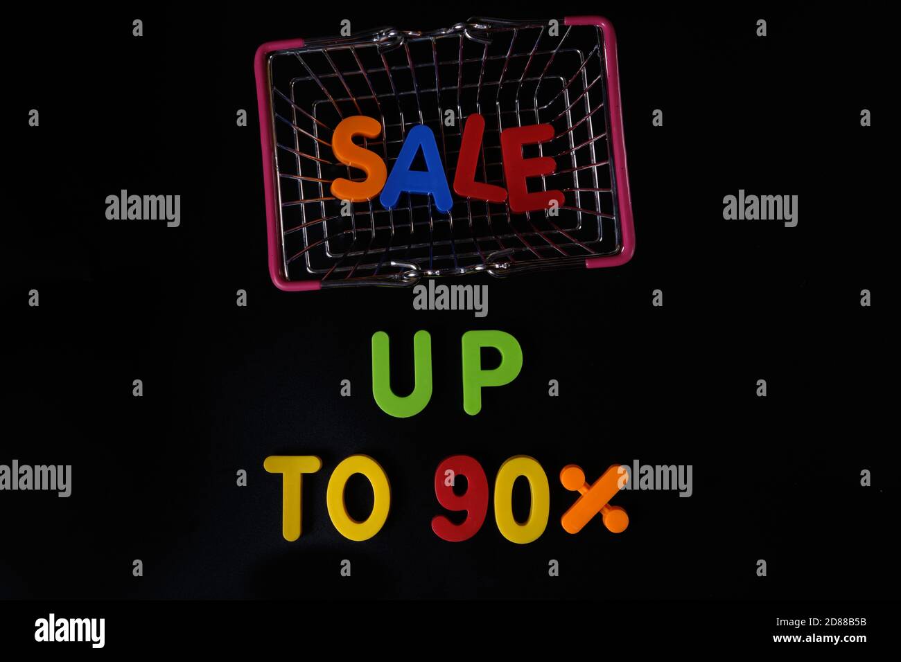 Black friday concept. Sale up to 90 per cent. Shopping basket at black Stock Photo