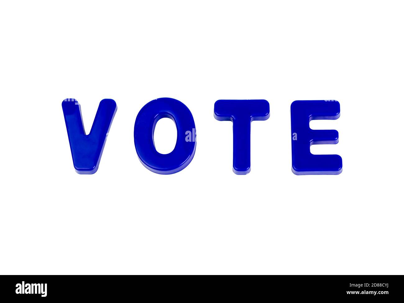 Text VOTE written in plastic letters on a white background. Concept for the electoral campaign. Stock Photo