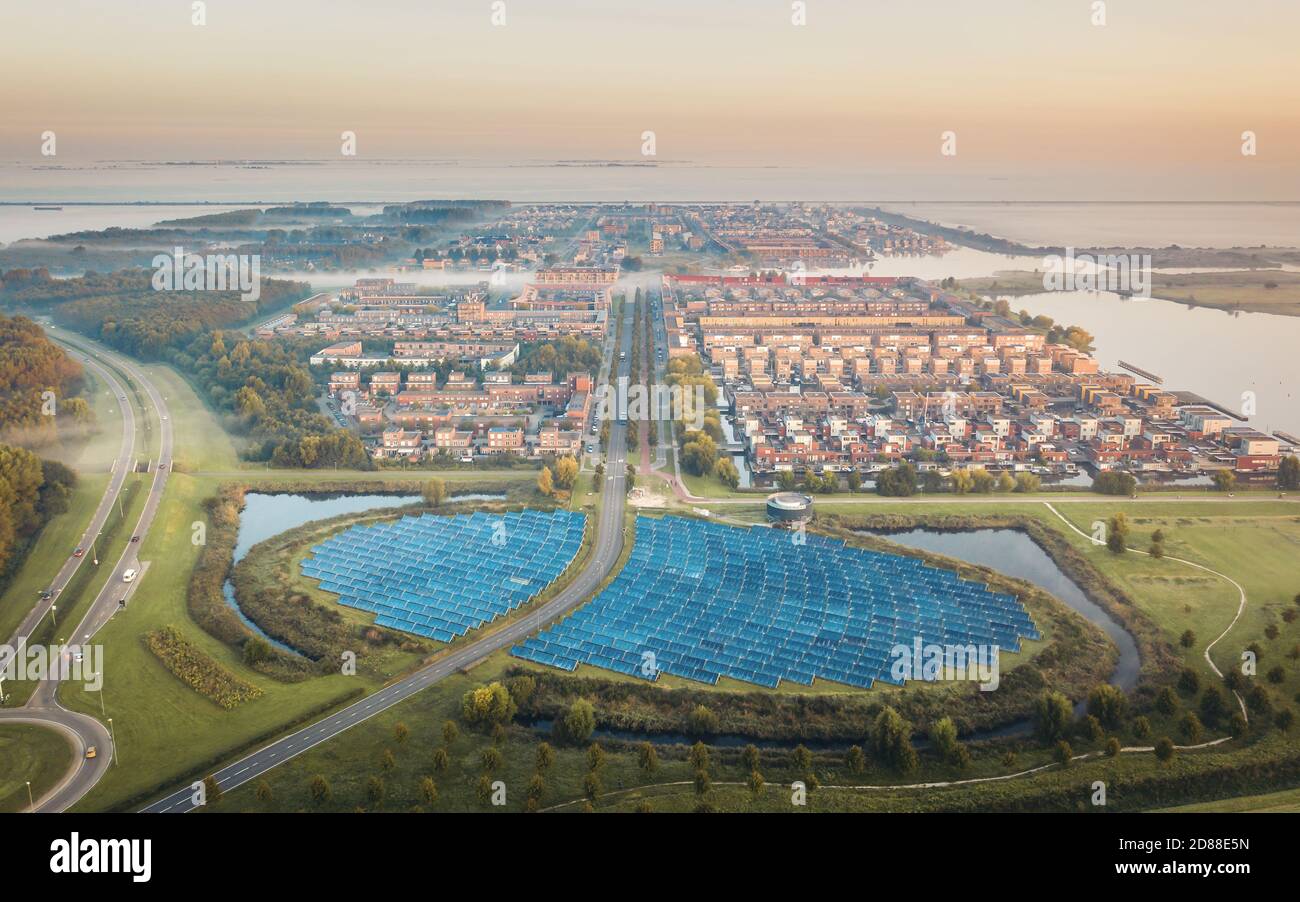 Sustainable green neighbourhood in Netherlands powered by solar panels, aerial view Stock Photo