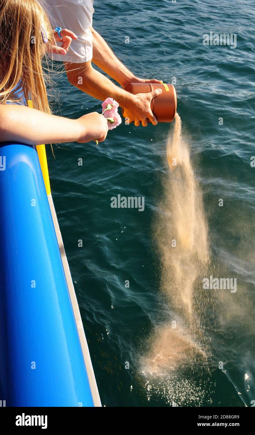 Scattering of funeral ashes in the sea after a cremation Stock Photo Alamy