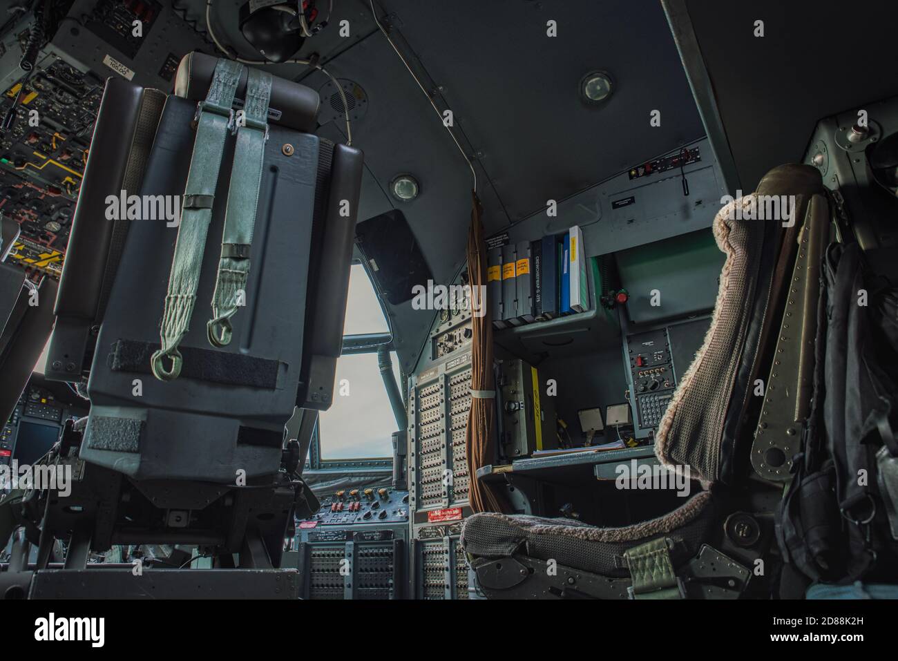 Military heavy cargo aircraft C130, C 130 Hercules cockpit or cabin with complex knobs and controls conveys aviation, aeronautics, navigation concept Stock Photo