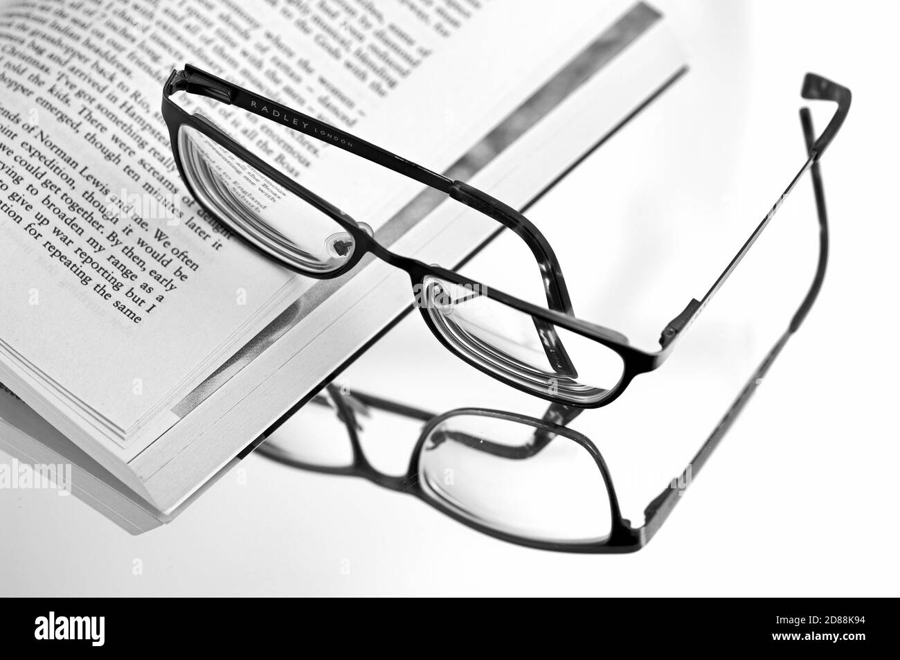 Reading glasses reflected in mirror Stock Photo Alamy