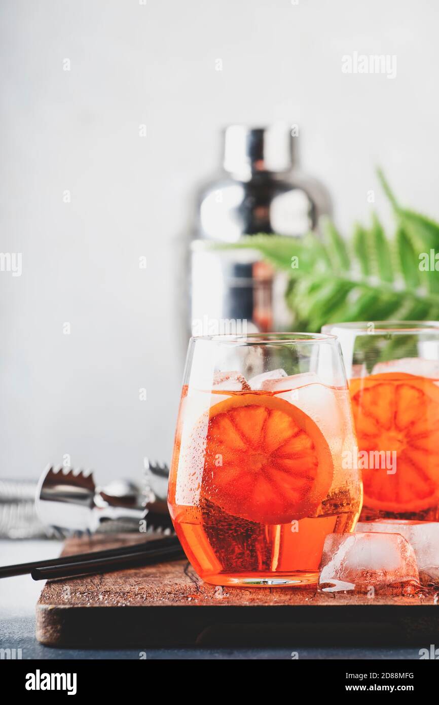 Aperol spritz cocktail in wine glass with sparkling wine, liqueur, ice