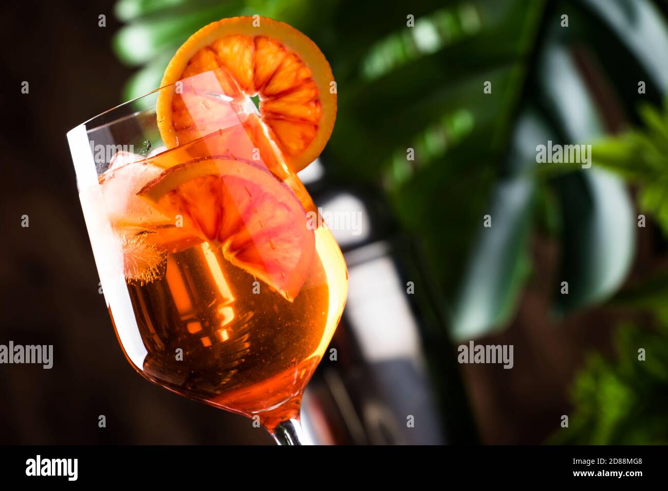 Aperol spritz cocktail in big wine glass with orange slices, summer ...
