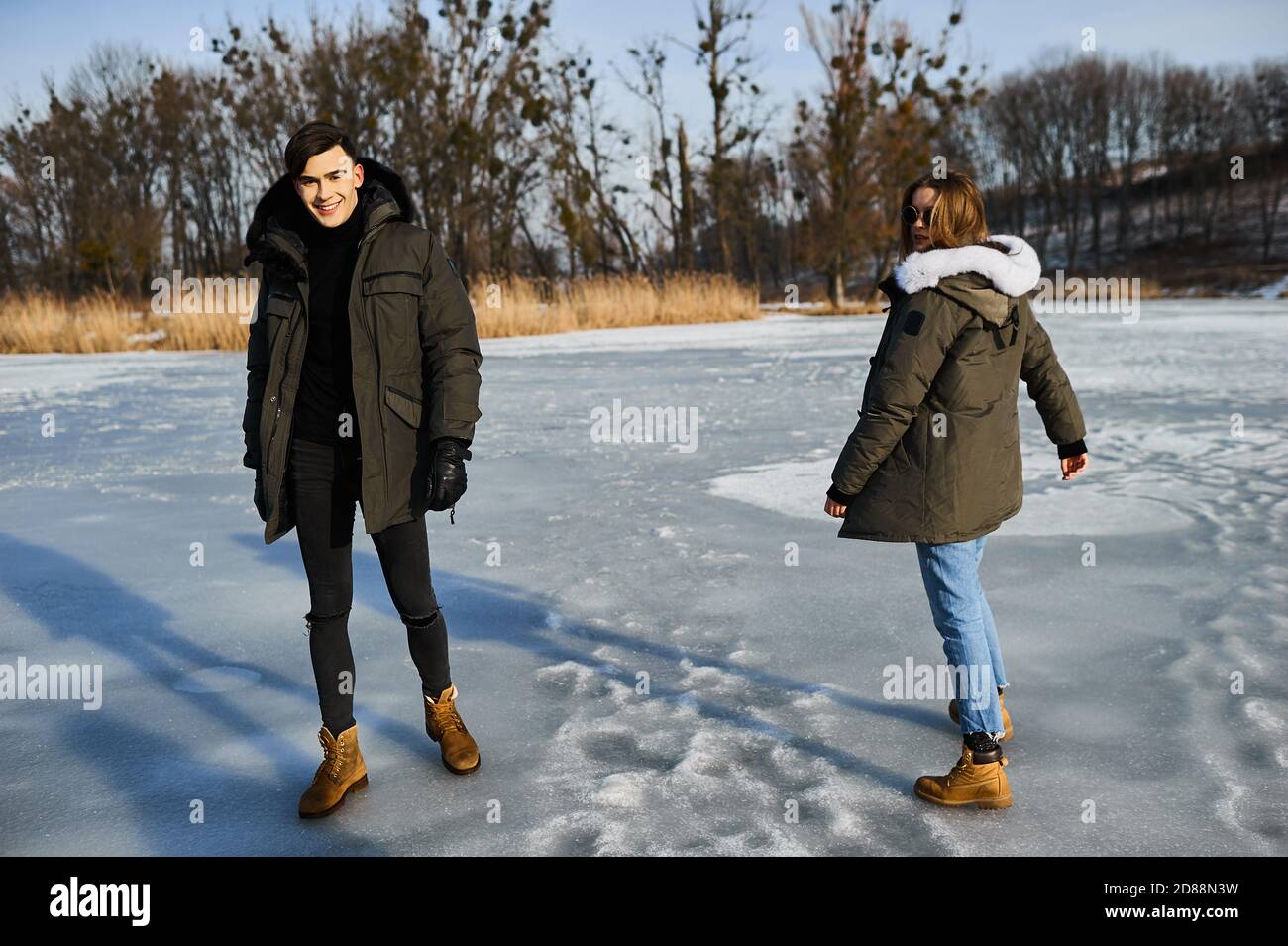 happy couple hugging and laughing outdoors in winter Stock Photo - Alamy