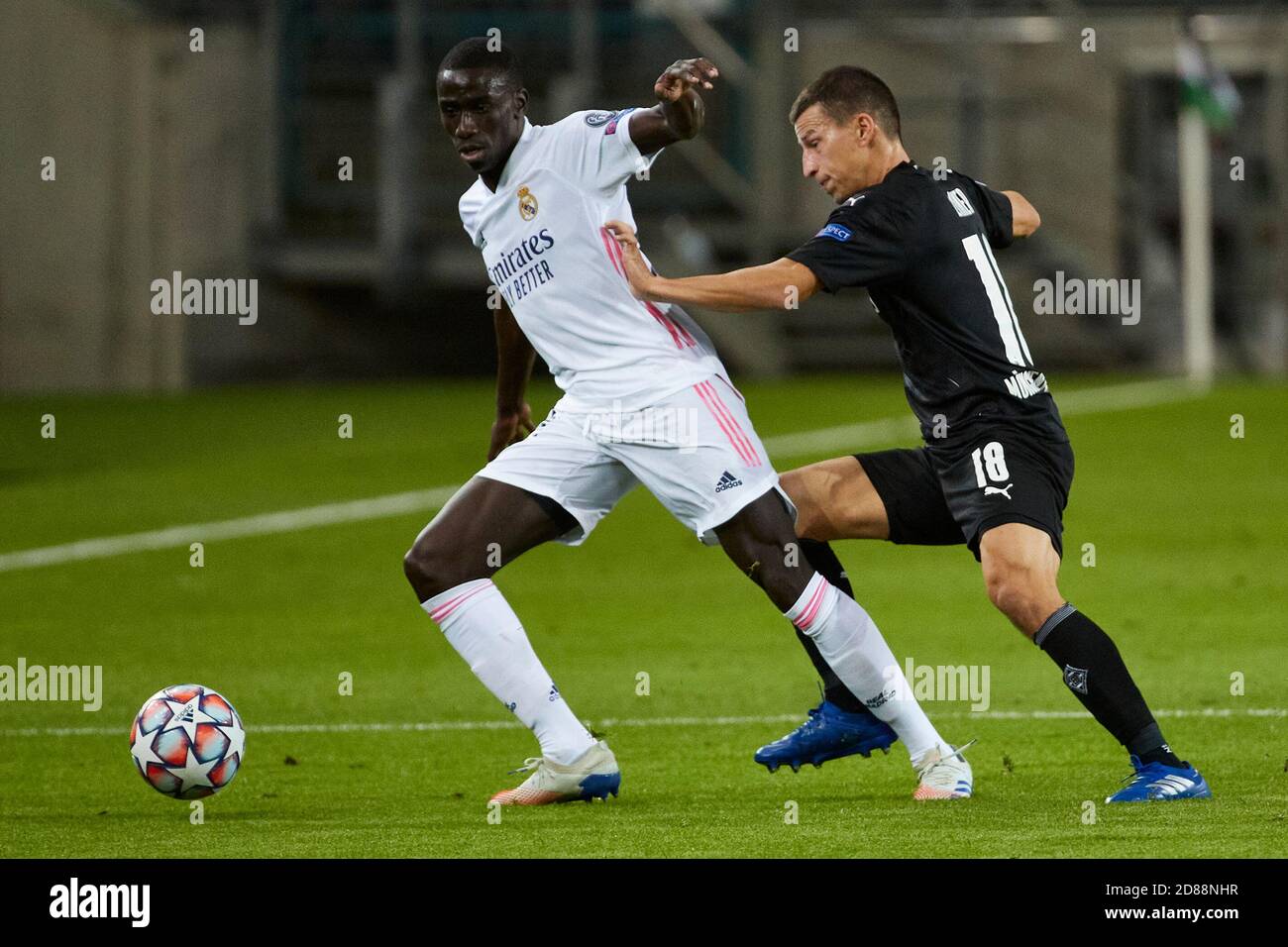 Monchengladbach, Germany. 27th Oct, 2020. Ferland Mendy of Real Madrid in action with Stefan Lainer of Borussia Monchengladbach during the UEFA Champions League match between Borussia Monchengladbach and Real Madrid at Borussia-Park on October 27, 2020 in Monchengladbach, Spain. Credit: Dax Images/Alamy Live News Stock Photo