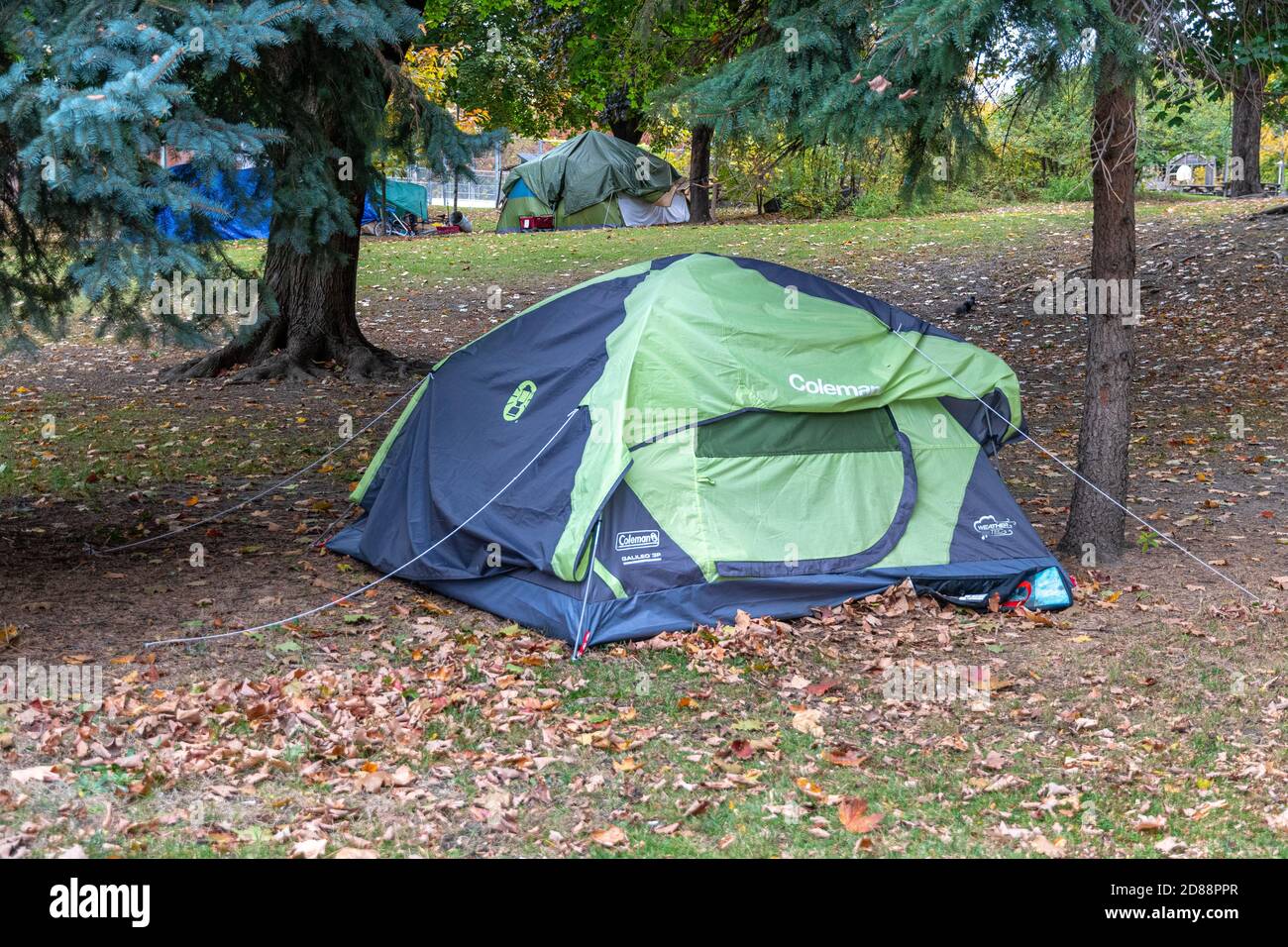 Tents of homeless people in public city parks. The Coronavirus pandemic has exacerbated the social issues in the country. Some prefer public parks to Stock Photo