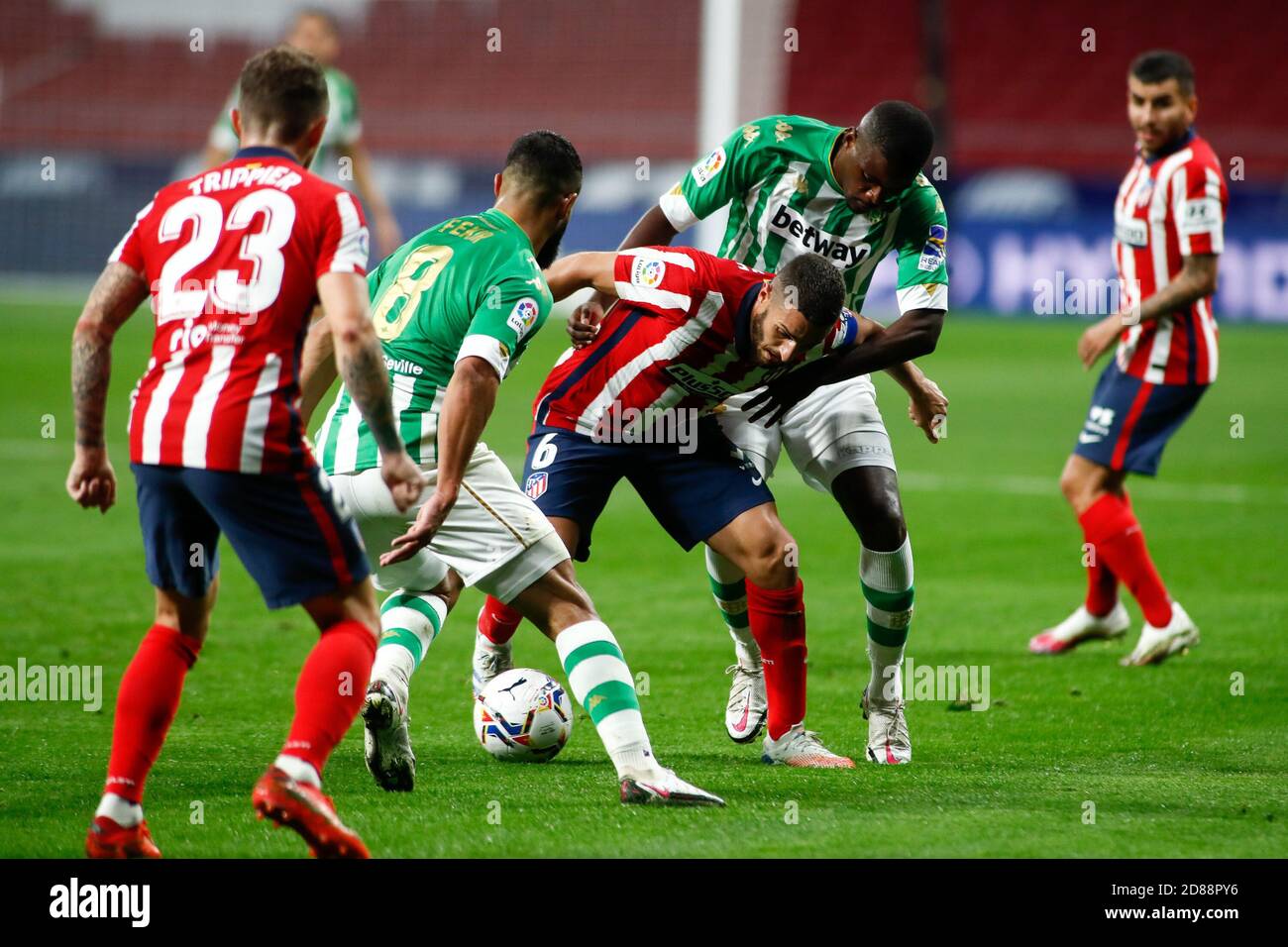 Jorge Resurreccion 'Koke' of Atletico de Madrid fight for the ball with William Carvalho and Nabil Fekir of Real Betis during the Spanish championsh C Stock Photo