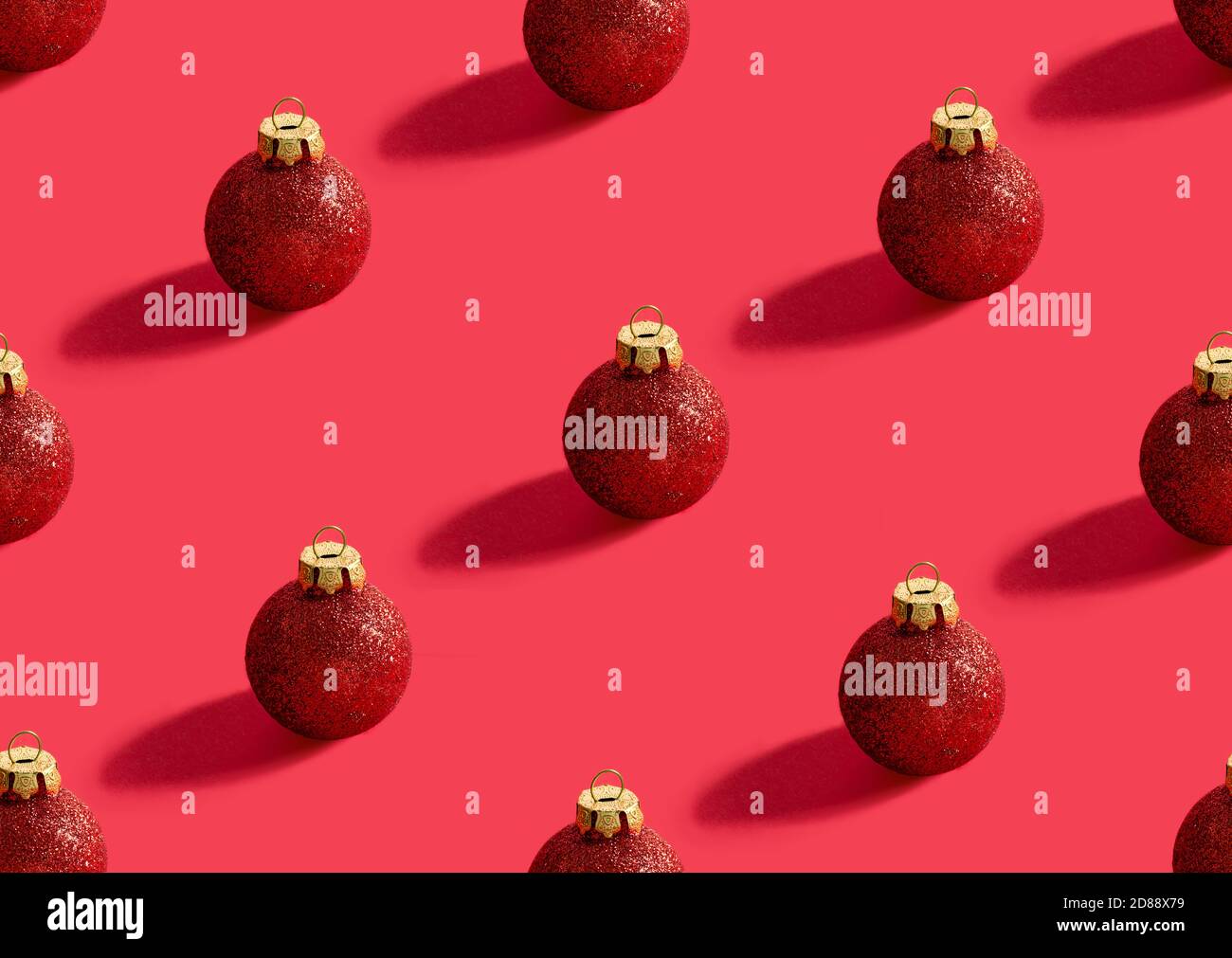 Christmas seamless pattern from red shiny balls on a pastel red ...