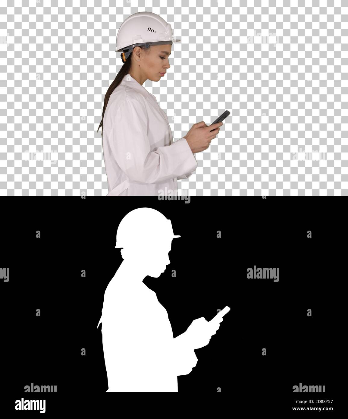 Engineer using mobile phone texting while walking, Alpha Channel Stock Photo