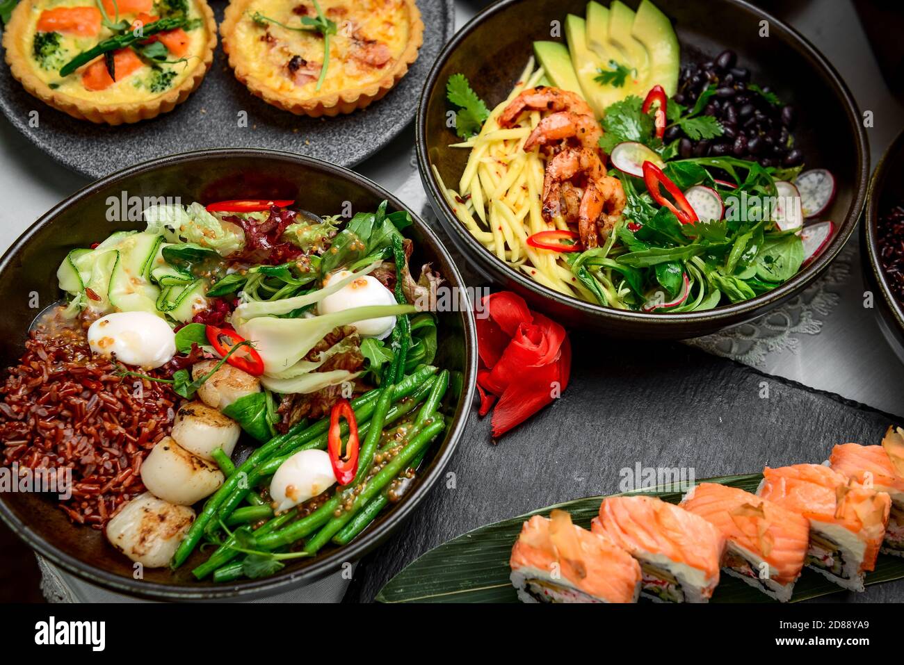 Mixed food, there are different dishes on the table Stock Photo