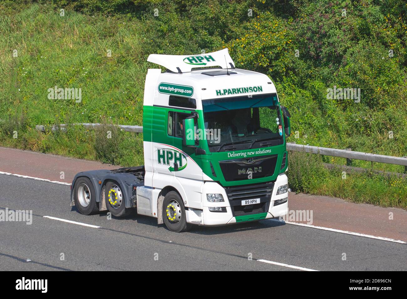 HPH group, H Parkinson Bulk Haulage delivery trucks, haulage, lorry, transportation, truck, cargo, Man TGX  tractor unit vehicle, delivery, transport, industry on the M61 at Manchester, UK Stock Photo