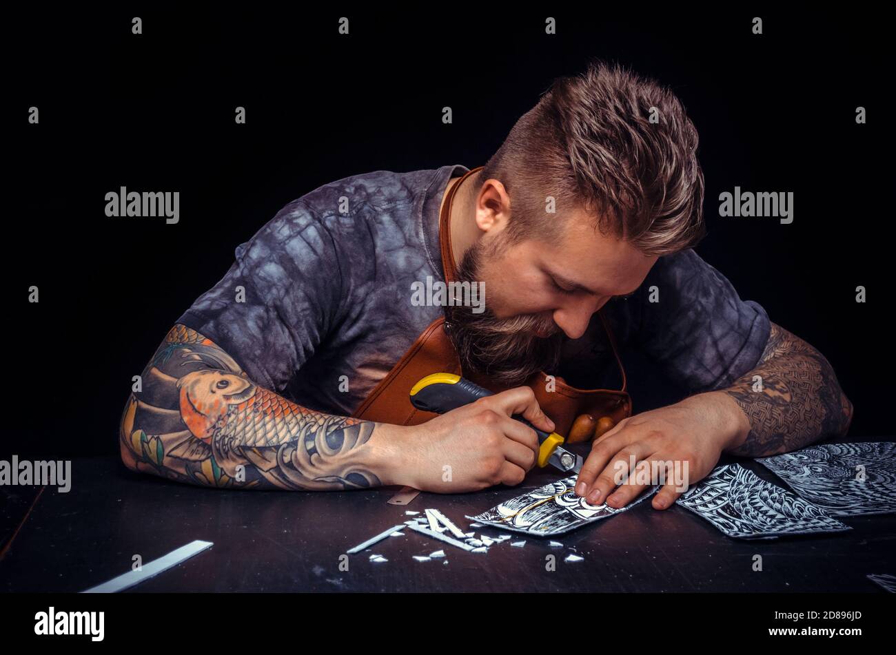 Leather Artist forms new leather product Stock Photo