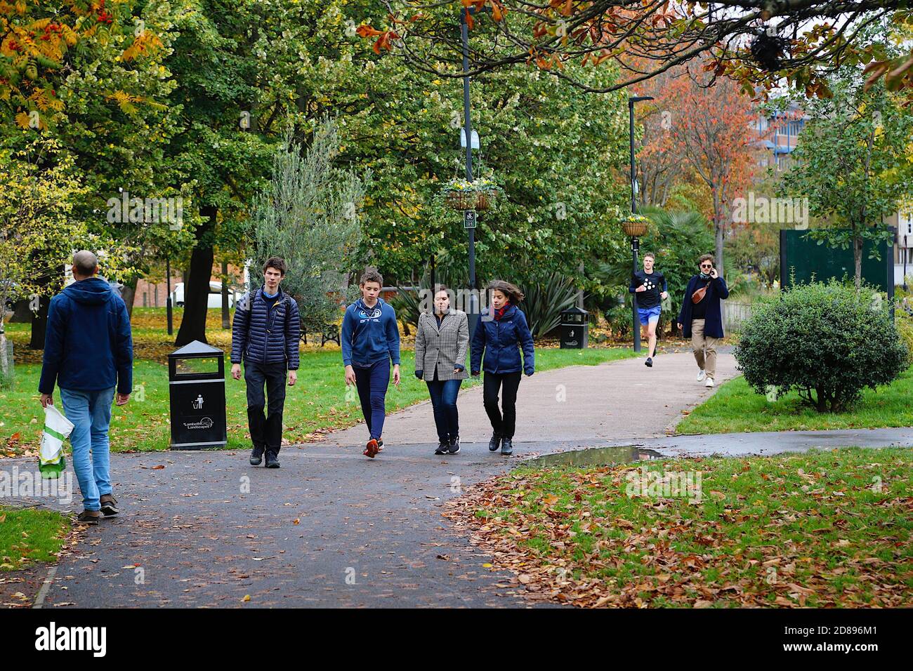 Vauxhall, London, UK. 28 Oct, 2020. UK Weather: Chilly but sunny with cloudy intervals and blustery winds. People enjoying the sunshine walking or running at the Vauxhall pleasure gardens. Photo Credit: Paul Lawrenson-PAL Media/Alamy Live News Stock Photo