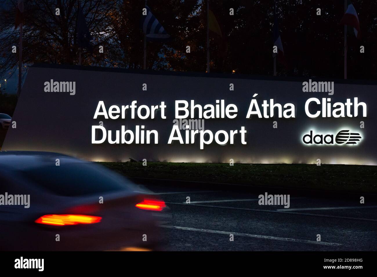 Dublin Airport illuminated signage in English and Irish Gaelic language at night in Dublin, Republic of Ireland, Europe, EU Stock Photo