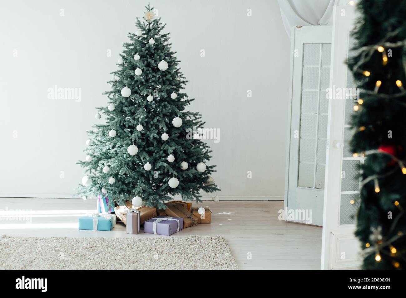 Christmas Tree Pine With Gifts New Year Decor House 2021 2022 Stock Photo - Alamy