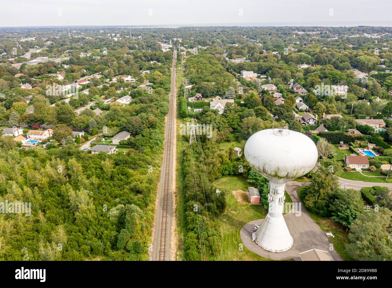 Water tower and LIRR tracks looking west in Southampton, ny Stock Photo