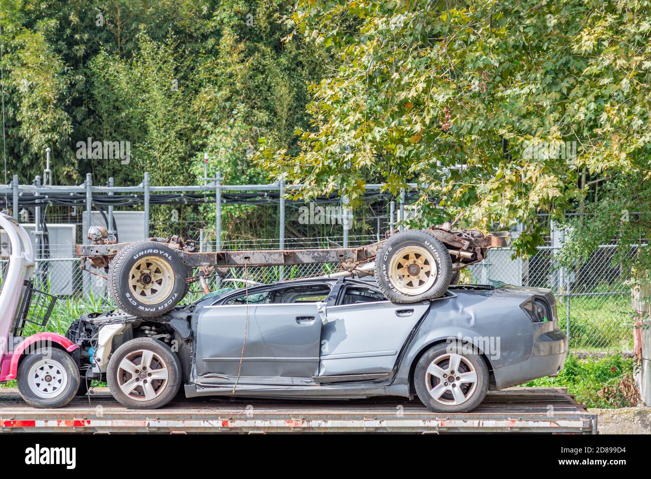 Partially crushed cars at a dump waiting to be recycled Stock Photo