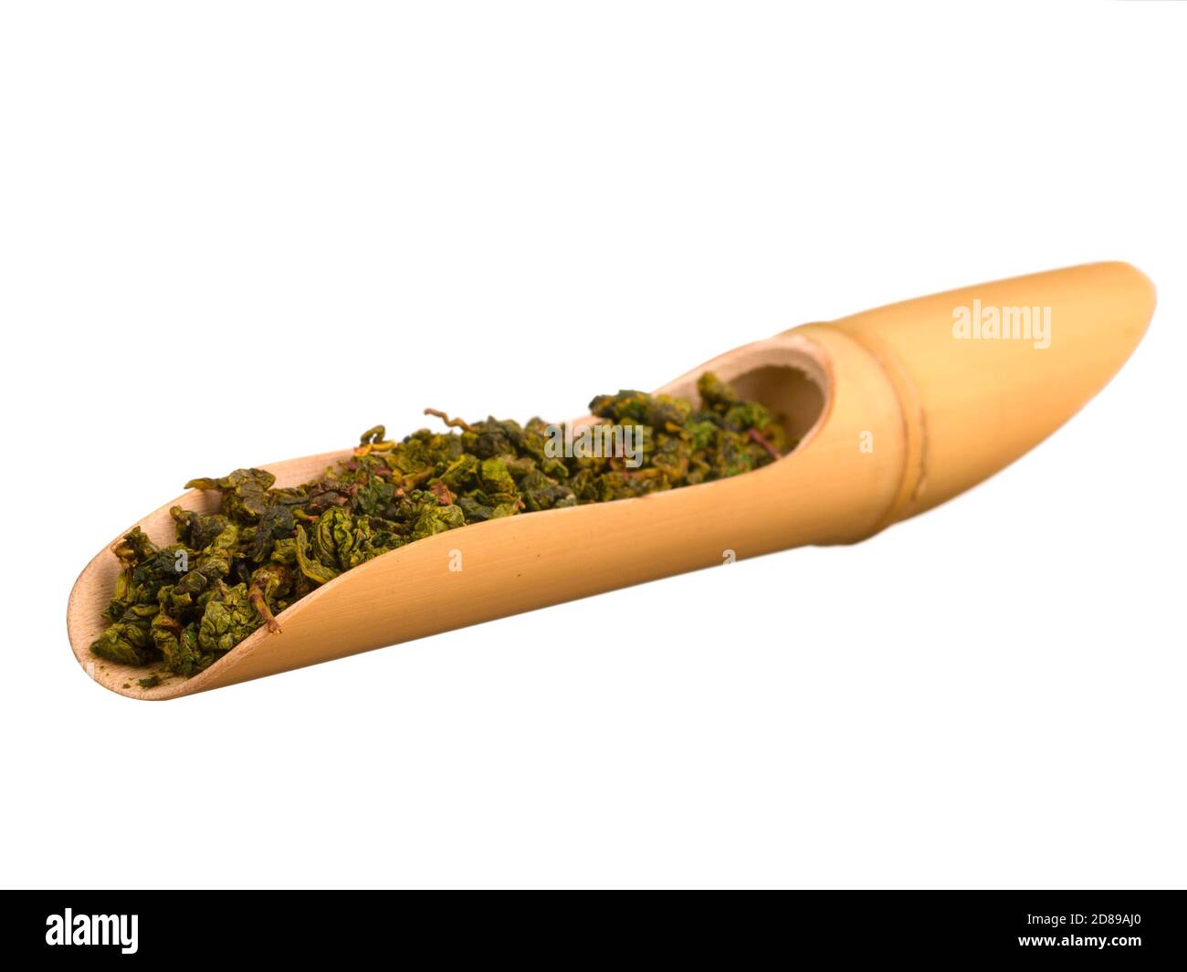 Oolong tea in bamboo scoop isolated on white background Stock Photo