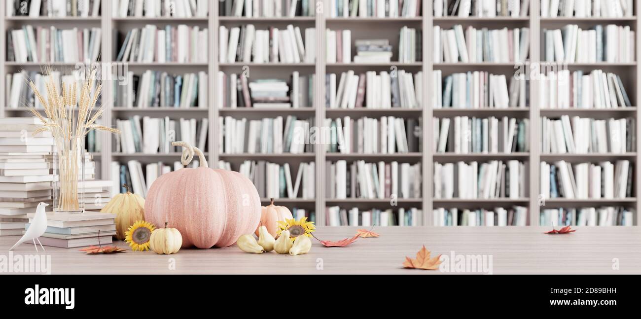 Autumn seasonal decoration with falling leaves and pumpkins on Bookshelf in the library