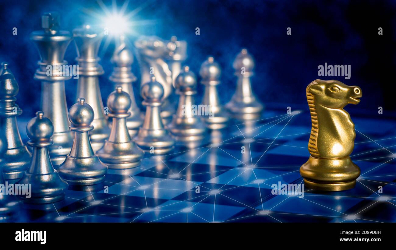 Golden knight chess is leadership in front off silver chess pieces on chess  board with network and communication flare light to fighting Stock Photo -  Alamy