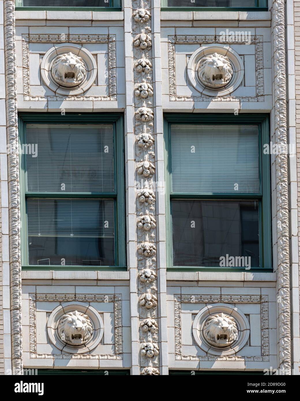 Carved male Lions' heads on Daniel Burnham's elaborate Beaux Arts Southern Building on 15th and H Streets NW in Washington DC Stock Photo