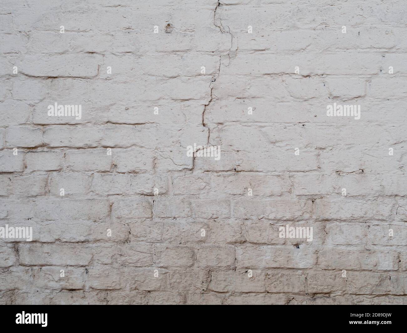 White cracked brick wal background, painted surface texture Stock Photo