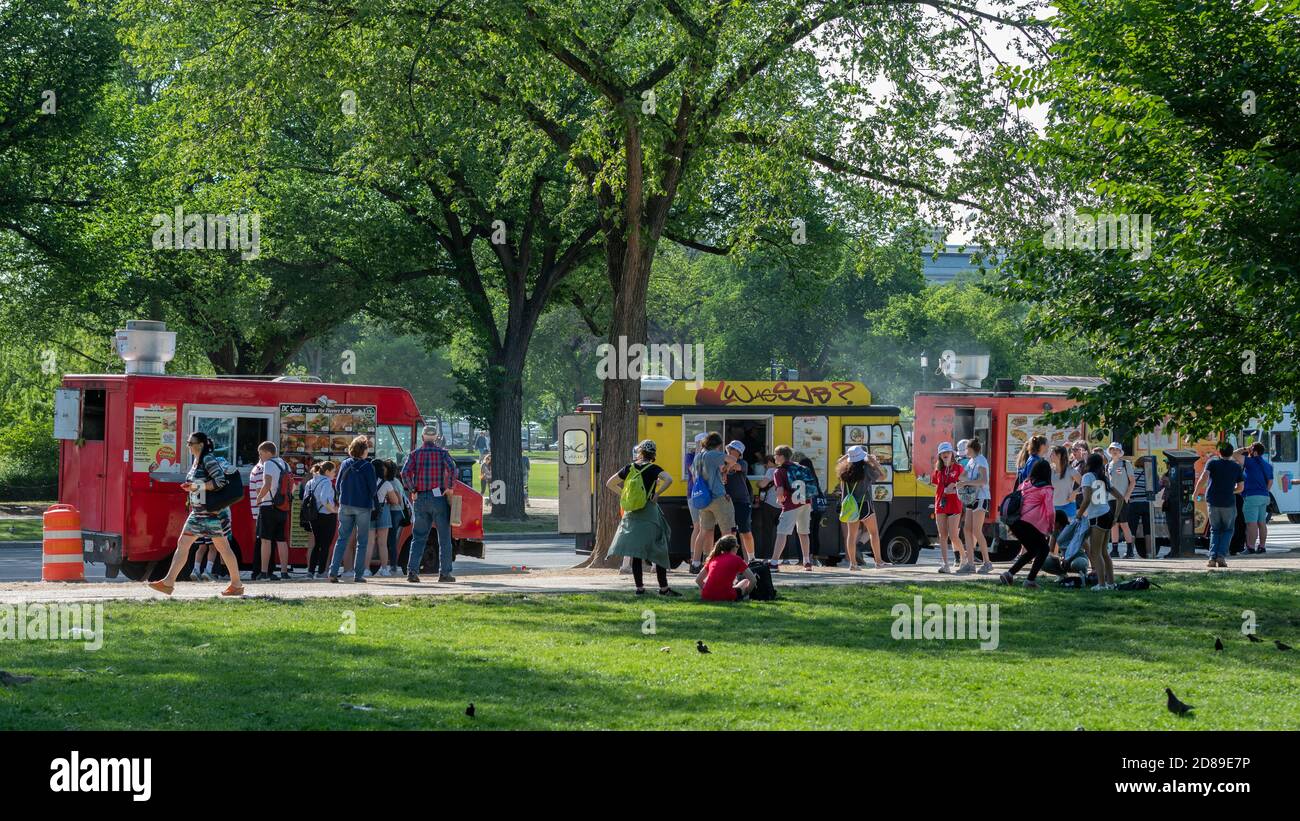Colourful fast food vans lining Fourth Street SW on the National Mall prove popular with students on a visit to the US capital Stock Photo