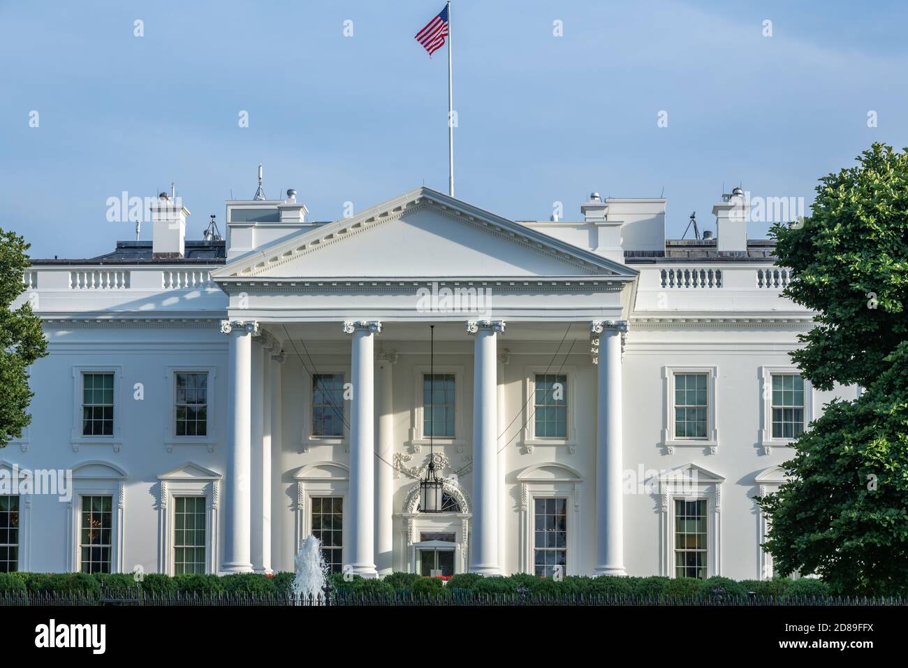 The northern facade of the neoclassical styled White House with its prostyle portico, segmented and pointed pediments, & balustraded parapet Stock Photo