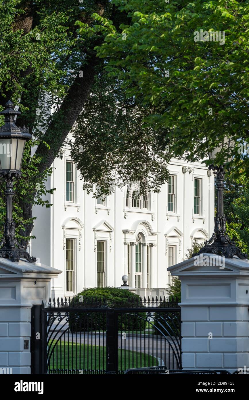 Early evening sunshine lights up the west facade of the White House. Stock Photo