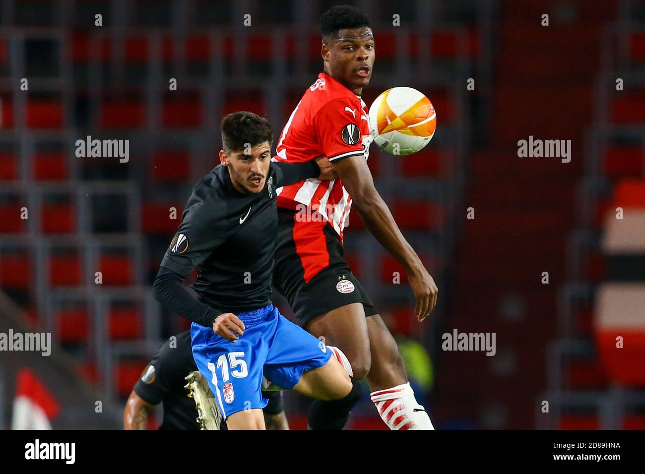 Carlos Neva of Granada, Denzel Dumfries of PSV Eindhoven during the UEFA Europa League, Group Stage, Group E football match between PSV Eindhoven an C Stock Photo