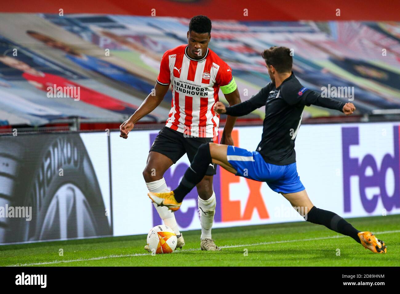 Denzel Dumfries of PSV Eindhoven, Carlos Neva of Granada during the UEFA Europa League, Group Stage, Group E football match between PSV Eindhoven an C Stock Photo