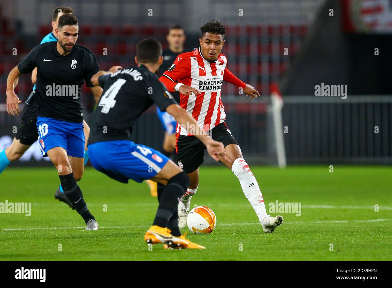 Donyell Malen of PSV Eindhoven and Maxime Gonalons of Granada during the UEFA Europa League, Group Stage, Group E football match between PSV Eindhov C Stock Photo