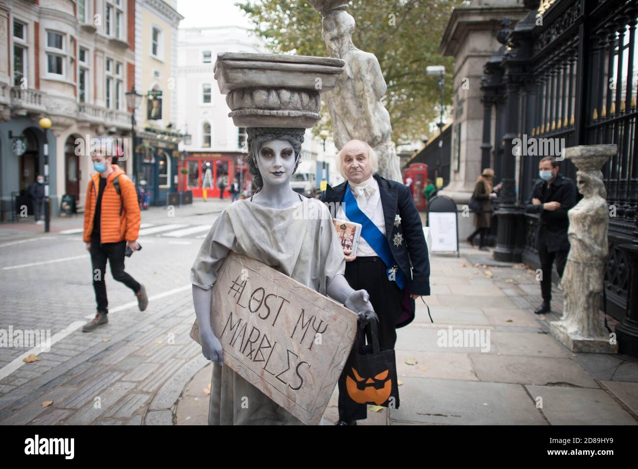 Campaigners dressed as Lord Elgin and a Parthenon Marble hand out