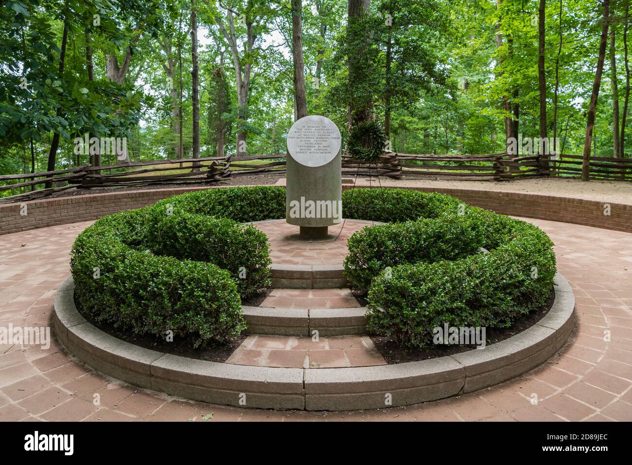 A gray, truncated, granite column marks Mount Vernon's Slave Memorial where free and enslaved people were buried in the 18 & 19th centur Stock Photo