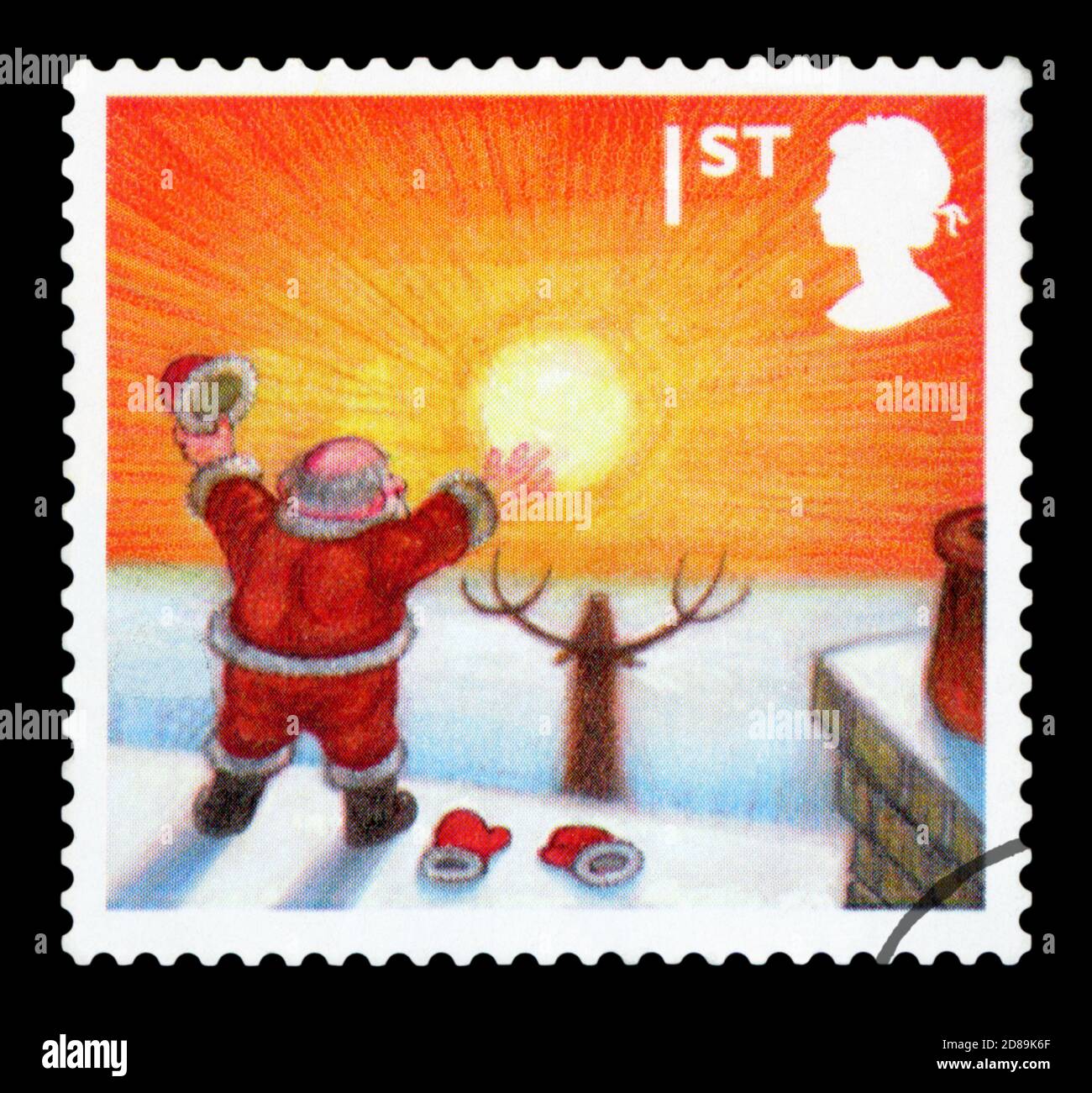 UNITED KINGDOM - CIRCA 2004: A stamp printed in United Kingdom shows Santa Claus Looking at rising sun, circa 2004 Stock Photo