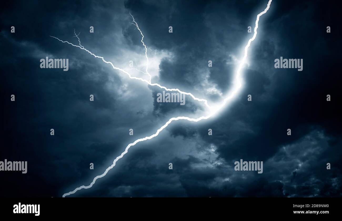 Lightning strike on the cloudy dark sky. Stock Photo