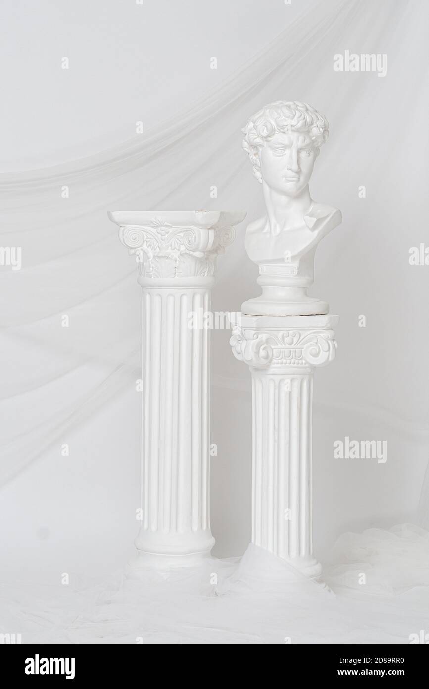 Vertical shot of the Renaissance epoch gypsum statues arranged with