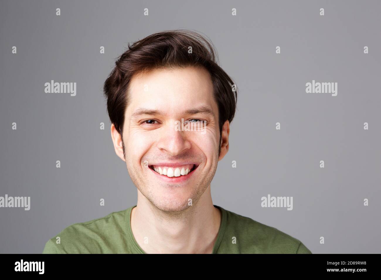 Happy young man standing hi-res stock photography and images - Alamy