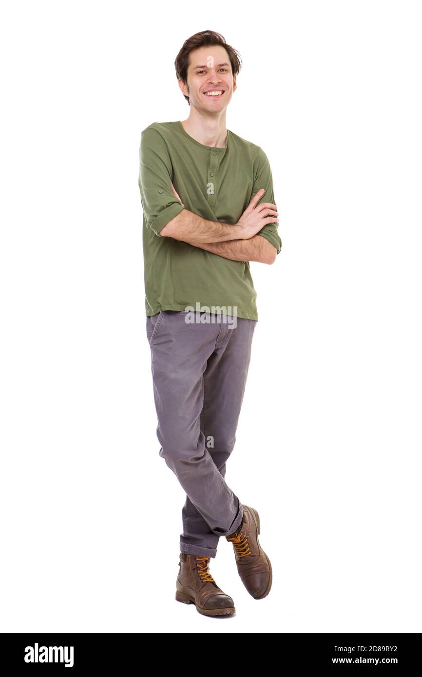 Full length portrait of casual man smiling and standing with arms crossed Stock Photo