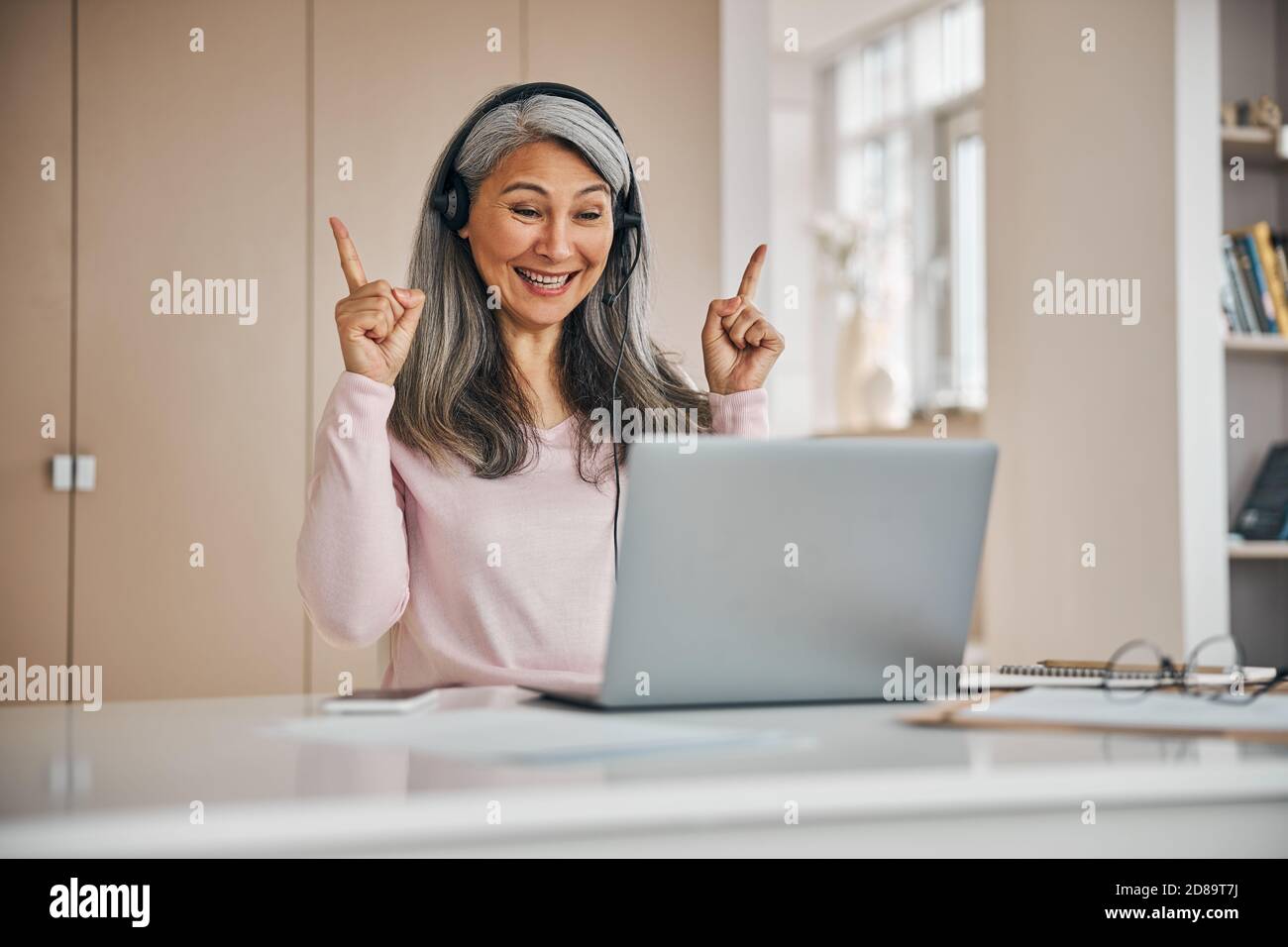 Professional female teacher learning speak the sign language of the