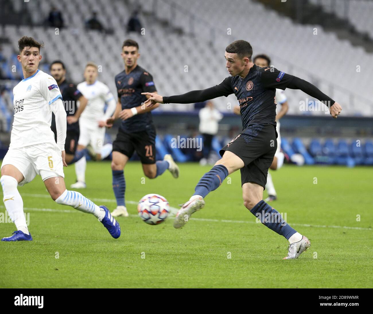 Phil Foden of Manchester City, Leonardo Balerdi of Marseille (left) during the UEFA Champions League, Group Stage, Group C football match between Ol C Stock Photo